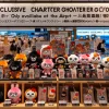 A display in Hokkaido airport showcasing exclusive character goods resembling Chiikawa characters, with a focus on their limited-edition nature. The items include keychains, plush toys, and other accessories, all with vibrant colors and designs reflecting Hokkaido's uniqueness. The display emphasizes that these goods are only available at the airport, with signage and labels indicating their limited nature. The scene captures the exclusivity and special feel of the products.